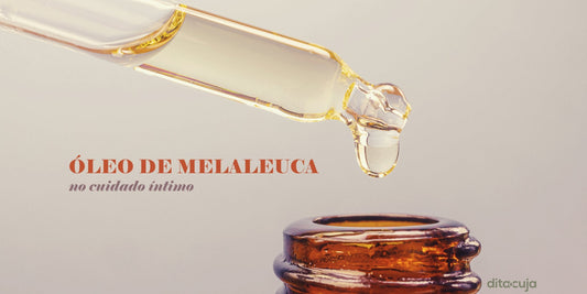 Conta gotas do óleo de melaleuca sendo pingado em fundo claro